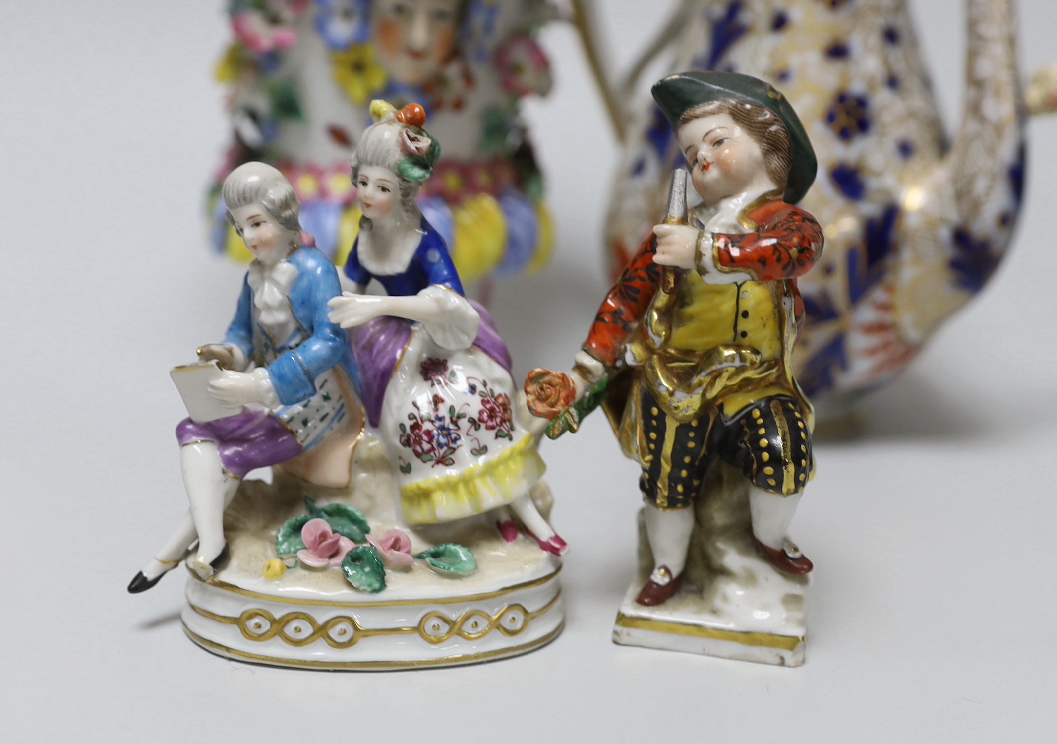 A 19th century German figure of a girl, 19cm, Vienna-type female figure, German figure of a boy and similar figure group, a continental coffee pot and an encrusted vase, the largest 18cm high